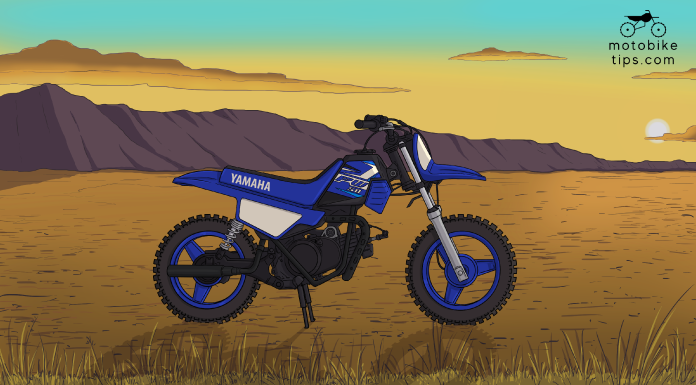 yamaha pw50 dirt Bike on off-roading area with mountain and sun in the background