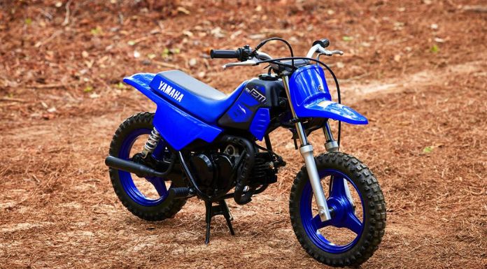 Isolated image of Yamaha PW50 dirt bike standing on the ground