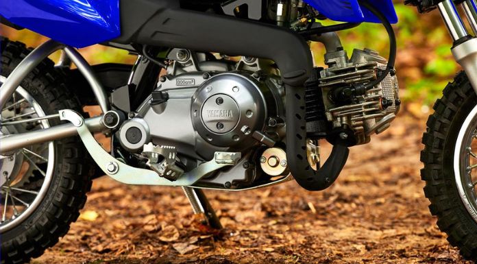 Close up image of the engine of Yamaha TTR50 dirt bike.