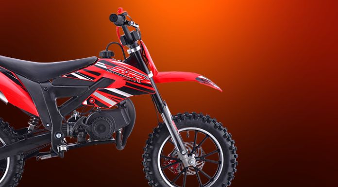 Side view image of ssr 50 dirt bike in red background