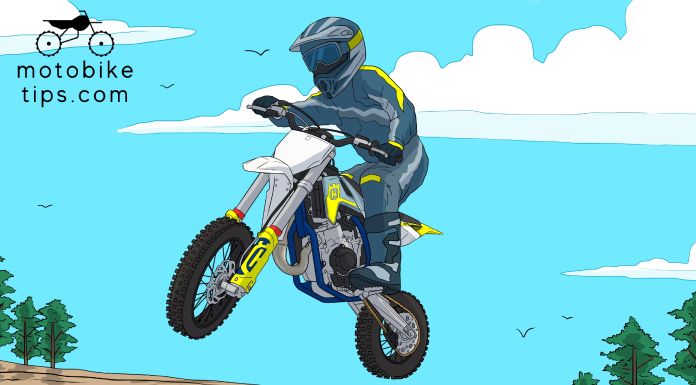 Young rider on a motocross track jumping off his Husqvarna 65 dirt bike