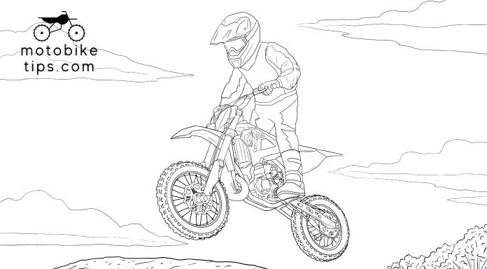 Young rider on a motocross track jumping off his cobra 65 dirt bike