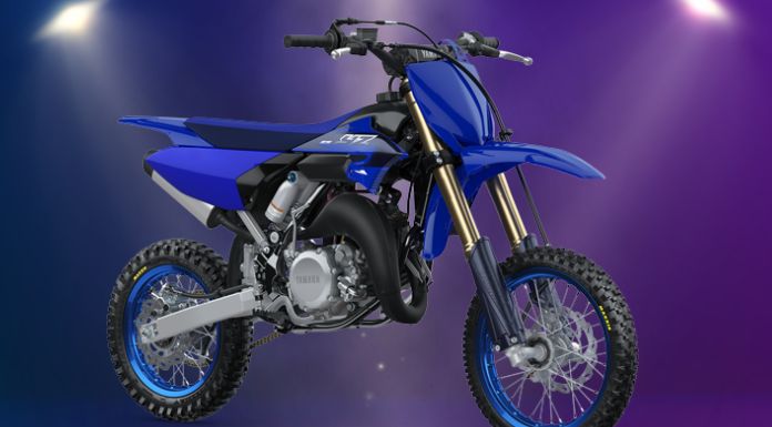 Isolated image of yamaha yz 65 dirt bike in purple background with spotlight