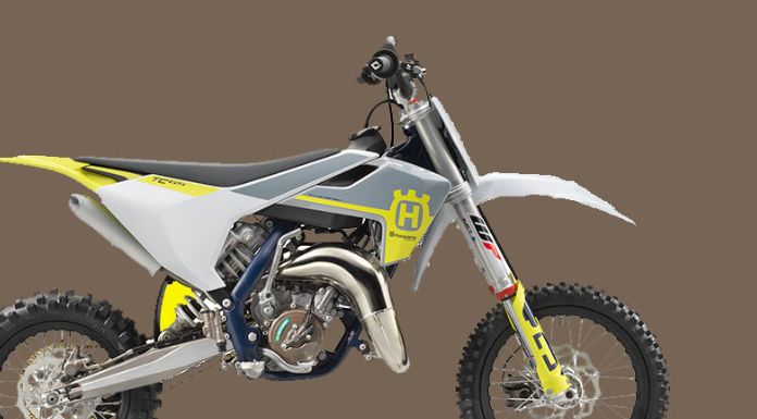 Sideview image of Husqvarna 65 dirt bike in grayish background