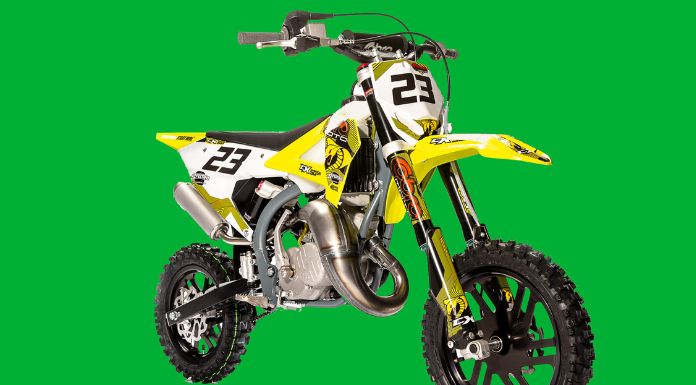 Isolated image of Cobra 50cc dirt bike in green background