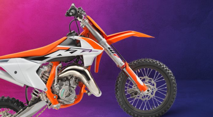 Side view image of KTM 65SX in pink to dark purple color