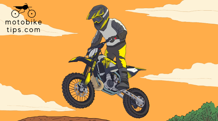 Young rider on a motocross track jumping off his cobra 65 dirt bike