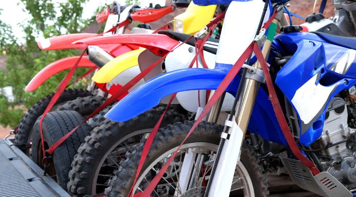Different colors of dirt bikes line up