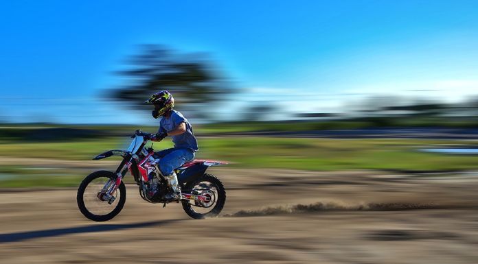 Man riding the dirt bike with a fast speed