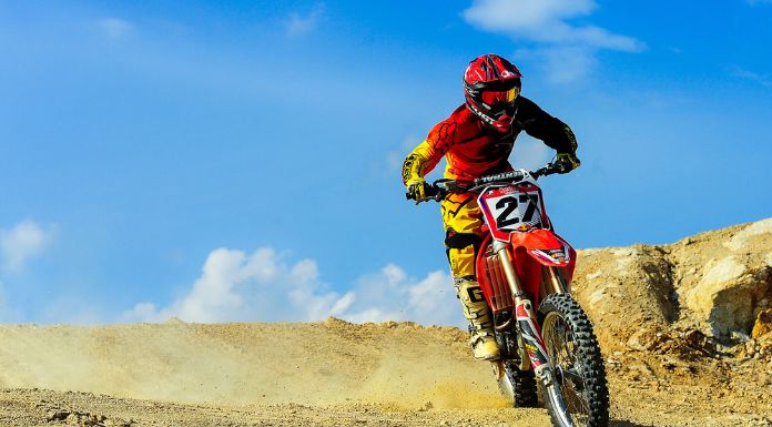 Man riding his dirt bike with beautiful sky in the background