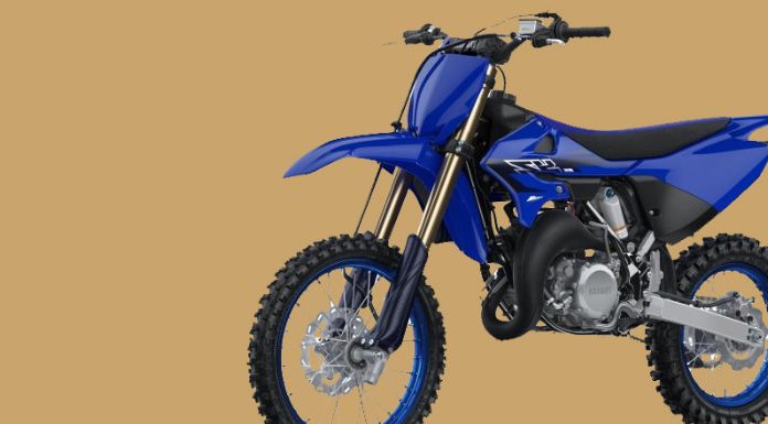 Isolated image of Yamaha YZ85 in brown background
