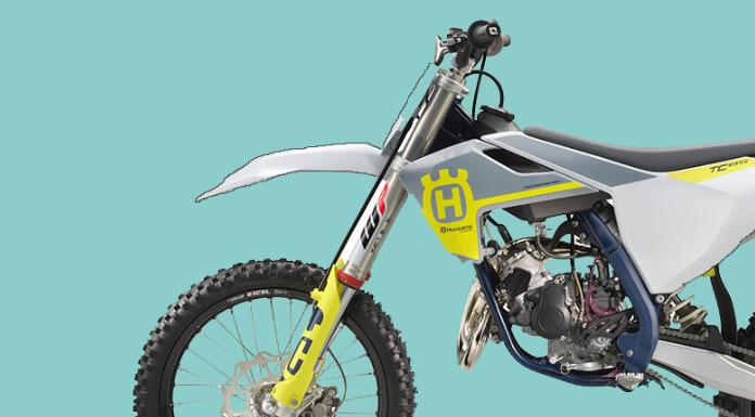 Isolated image of Husqvarna TC 85 in blue background