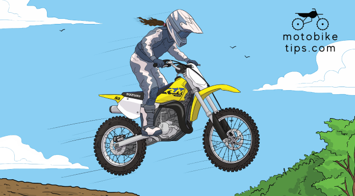 Young man jumping off his Suzuki 85cc dirt bike